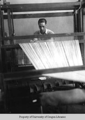 Mountain Weavers: young man at loom