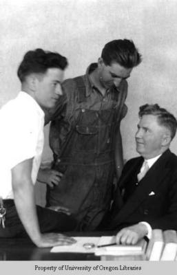 Dean Baird [with two unidentified male students]
