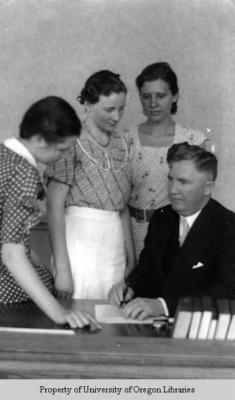 Dean Baird [with 3 unidentified female students]