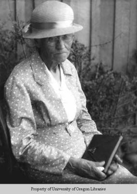 Elderly woman, with book