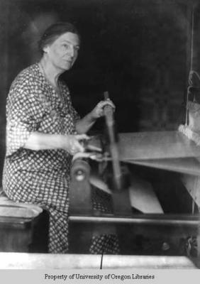 Ms. Duffield, spinner and weaver, weaving