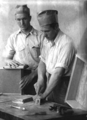 Carpentry Shop, Berea College: two students building cabinets