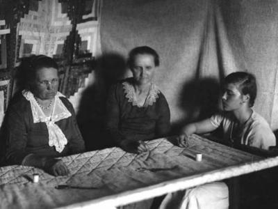 Ms. Ray Burnett with mother and daughter, quilting