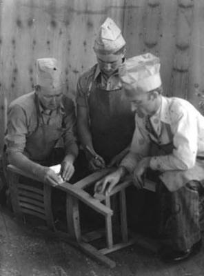 Carpentry Shop, Berea College: three men working on a chair