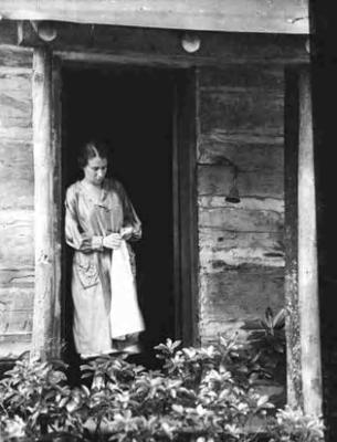 Clementine Douglass, spinner, in cabin door