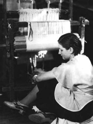 Weaving Room, Berea College; student by loom [working harness?]