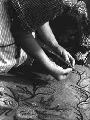 Mrs. Sarah Owen Anderson, making hooked rug