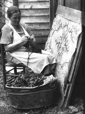 Mrs. Sarah Owen Anderson, making hooked rug