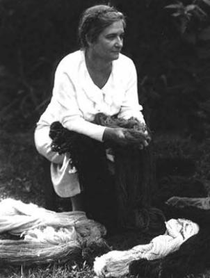 Mrs. Arema Stone Viner, seated with yarn