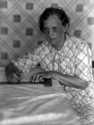 Mrs. C.U. Wood, leader of spread making enterprise, at work