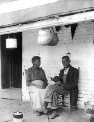 African-American woman and man on porch