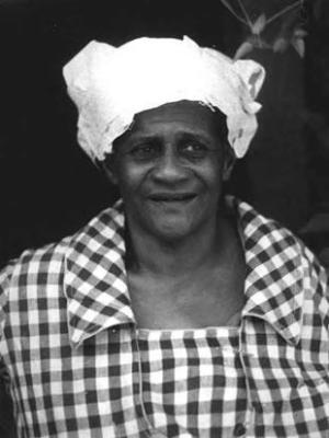 African-American woman in plaid shirt