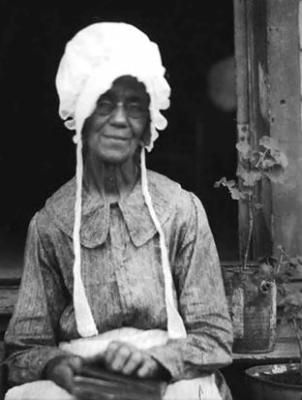 Elderly African-American woman, wearing bonnet