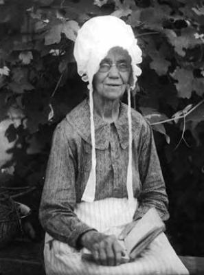 Elderly African-American woman, wearing bonnet