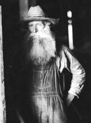 Man with beard, in barn